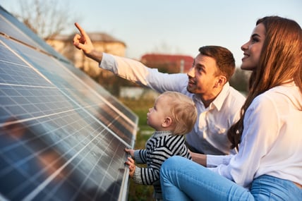 happy family liking at solar panels-1