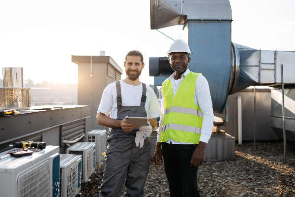 maintenance man and Co-op Coordinator inspecting assets