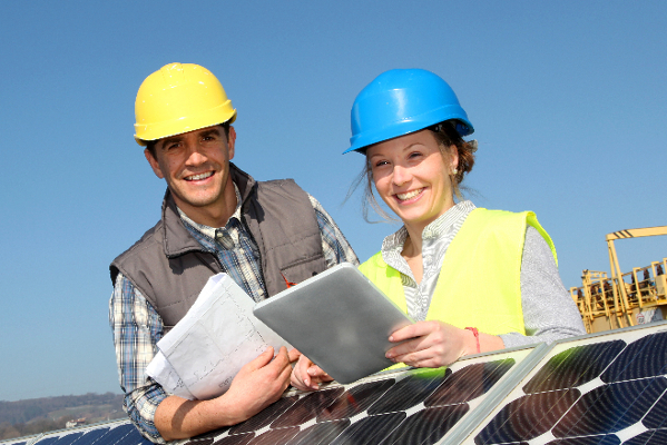 two smiling renewable energy consultants